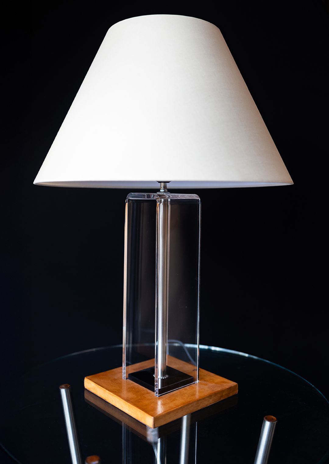 lamp in prexiglass with base in wood covered with leather and  finished with shellac